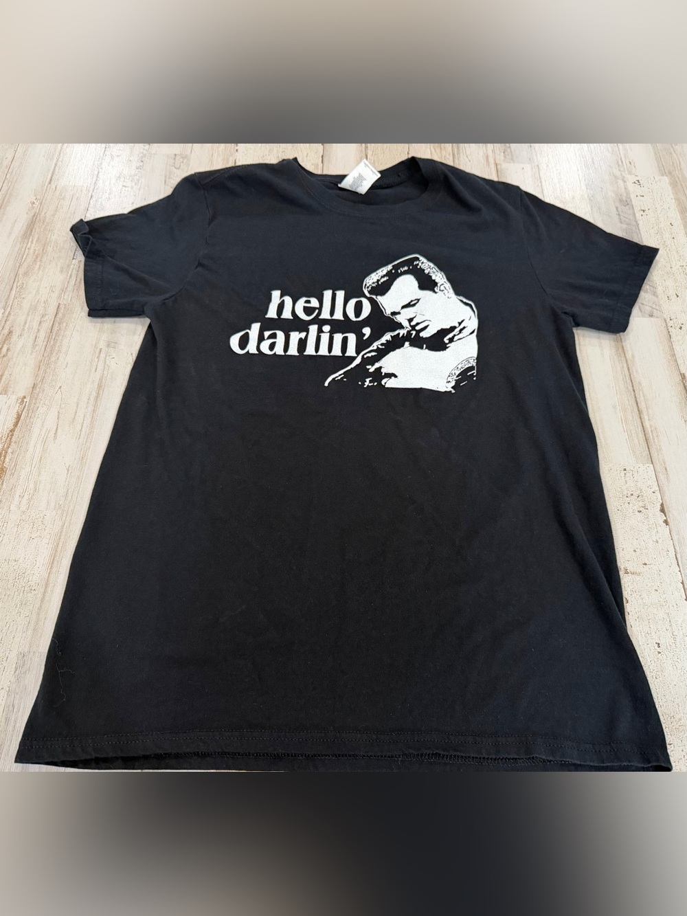 Black graphic T-shirt featuring an Elvis Presley-style “Hello Darlin’” design on